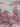 Close-up of wine-red toile fabric showing skeleton figures beside barrels