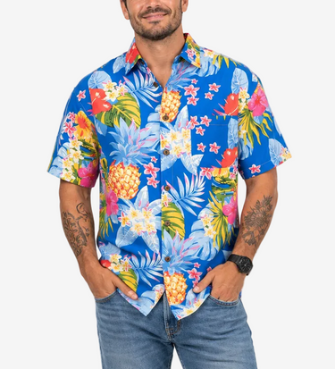 Male model wearing Lowes blue pineapple and floral tropical Hawaiian shirt with jeans, front full-length view