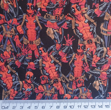 Marvel Deadpool Packed black cotton fabric featuring red and black Deadpool comic artwork