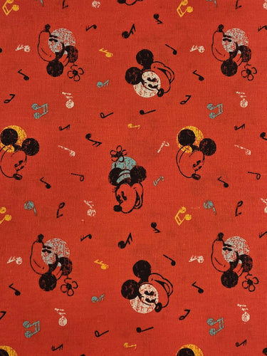 Mickey Mouse Musical Notes red cotton fabric with Mickey heads and music notes