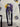 Close-up of Jack Skellington coffin motifs on Nightmare Before Christmas cotton fabric