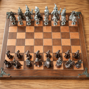 Lord of the Rings themed chess set showing detailed metal figures and board.