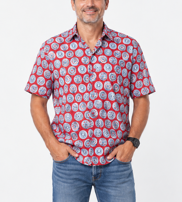 Full-length male model wearing red and blue wheel print Planet Retro Original cotton shirt with blue jeans
