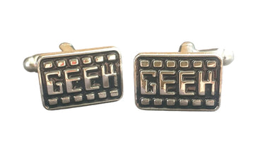 Silver 'GEEK' cufflinks on a white background