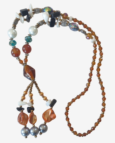Multicolored beaded necklace on a light background