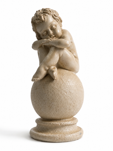A beige stone or resin figurine of a sleeping cherub sitting on a round pedestal, photographed against a plain white background.