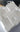 White foam packaging block with 'Gentle Giant' branding on a blurred background