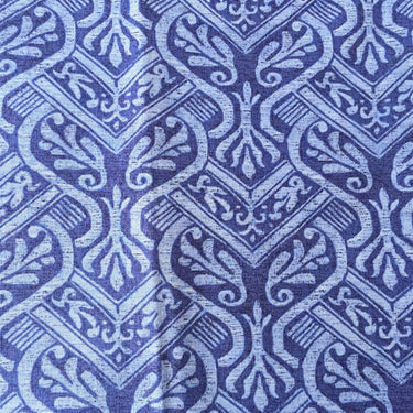 Close-up of blue and light blue ornamental fronds on Timeless Treasures Court cotton fabric