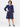 Trollied Dolly navy blue swallows print retro dress shown on female model, additional front studio view