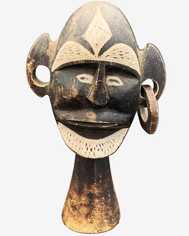 Vintage African tribal head sculpture in cast stone composite with aged decorative finish.