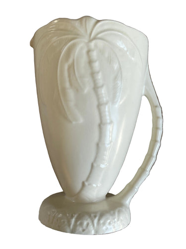 Vintage Beswick cream ceramic palm tree jug with raised palm frond detail.