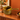 Vintage Beswick Zorba olive green sauce boat on a wooden sideboard against a burnt orange wall