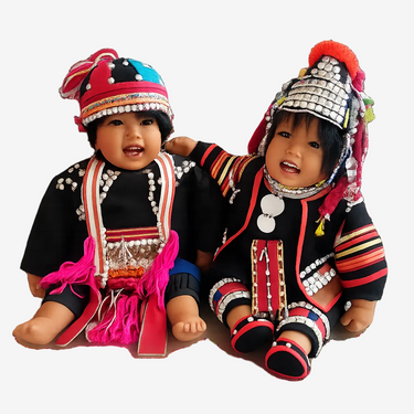 Vintage 1991 Carlos Götz Akha dolls pair in handmade tribal costumes with colourful beadwork and metallic details.