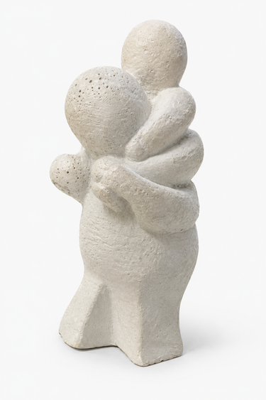 Small vintage Dutch stone sculpture of an adult carrying a child on their shoulders.