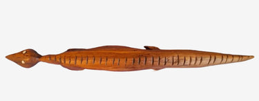 Vintage hand-carved wooden crocodile figurine with elongated sculptural design and carved detailing.