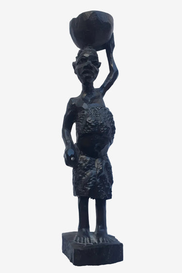 Vintage carved wooden African female figure carrying a baby and basket, black decorative sculptural object.