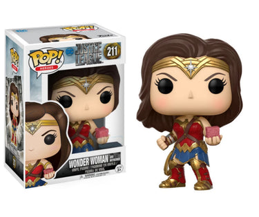 Funko Pop! Wonder Woman figure next to its packaging on a white background
