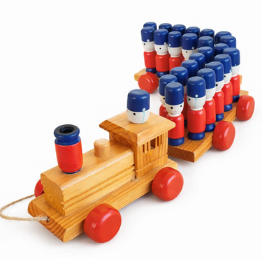 Vintage wooden pull-along toy train with red wheels carrying painted wooden soldiers on two wagons