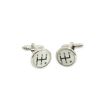 A pair of silver metal cufflinks with a domed gear shift pattern.