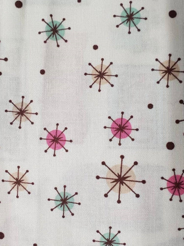 Northcott Mel’s Dinner cotton fabric with colourful retro atomic stars on cream
