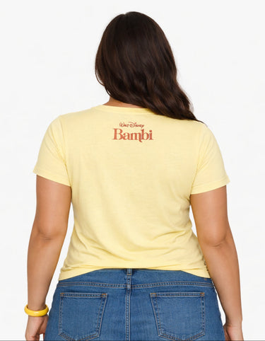 Person wearing a yellow t-shirt with 'Bambi' text on the back, standing against a white background