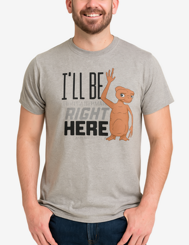 Man wearing a gray t-shirt with a cartoon character and text on a plain background