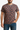 Man wearing a t-shirt with fox pattern on a plain background
