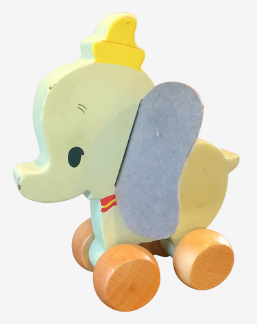 Toy elephant with wheels on a white background