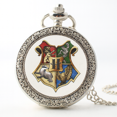 Pocket watch with Hogwarts crest design on a white background