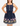 Woman wearing a navy blue dress with fairy tale-themed print on a beige background