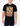 Man wearing a black t-shirt with a graphic design and text.