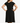 Woman wearing a black dress against a beige background