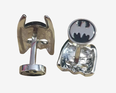Batman-themed cufflinks on a white background