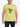Person wearing a yellow t-shirt with a graphic design of a green character and text.