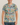 Man wearing a t-shirt with superhero comic book design on a plain background