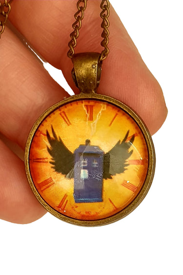 Necklace with pendant featuring a blue box and wings on an orange background