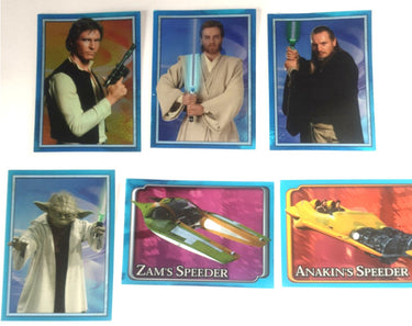 Six Star Wars stickers arranged on a white background, featuring characters and vehicles including Yoda, Obi-Wan, Han Solo, and speeder bikes.