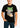 Person wearing a black t-shirt with a graphic design on a plain background
