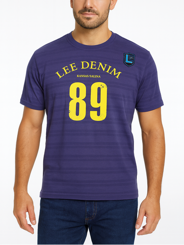 Man wearing a purple Lee Denim t-shirt with yellow text on a white background