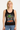 Person wearing a black tank top with graphic designs on a white background