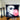 Decorative pillow with a face design blowing a bubblegum bubble on a table with candles and beads.  Planet Retro NZ