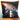 Black pillow with a toy gun design on a wooden surface with toys around.  Planet Retro NZ.