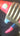 Close-up of a brass fitting with red and blue accents on a dark background.  Planet Retro NZ