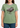 Person wearing a green t-shirt with a piano graphic and text on a plain background