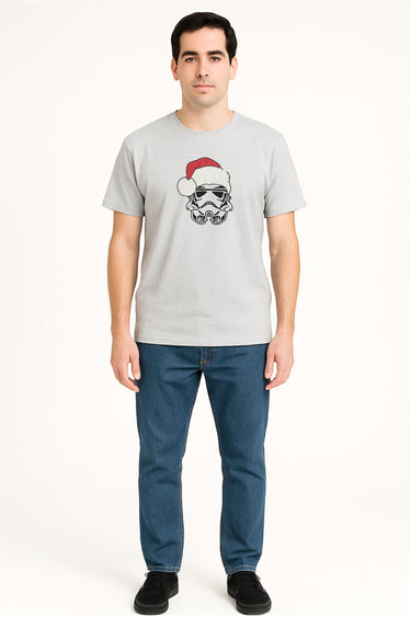Man wearing a gray t-shirt with a graphic design on a white background