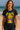 Woman wearing a black t-shirt with a colorful graphic design on a beach