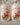 Two Christmas-themed salt and pepper shakers with Santa Claus on a white background