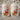 Two Christmas-themed salt and pepper shakers with Santa Claus on a white background