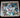 Box of colorful puzzle pieces on a wooden surface