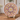 Decorative plate with floral patterns on a stand in a home setting